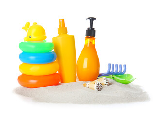 Sunscreen cream with beach sand toys on white background