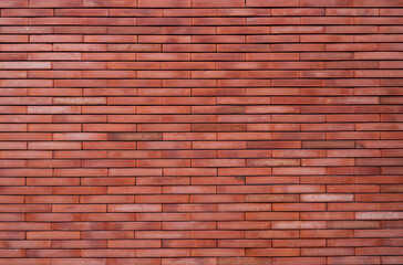 Orange brick wall texture background. Orange vintage pattern wallpaper. Grunge brick wall interior building architecture. Orange shade brick wall texture. Home interior design. Orange wall of house.