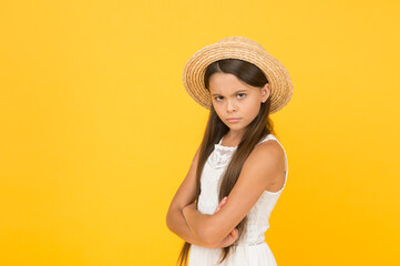 Dissatisfaction. Moody little girl wearing elegant hat. summer holiday. Summer tour. Leisure and entertainment concept. Summer Vacation. Sale and discount. Goods for kids. Bad mood. Sad child