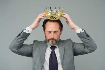 Kill your pride before you lose your head. Big boss wear crown with pride. Proud businessman grey background. Bearded man in formalwear. Pride and egoism. Pride and ambitions. Toxic ego - obrazy, fototapety, plakaty