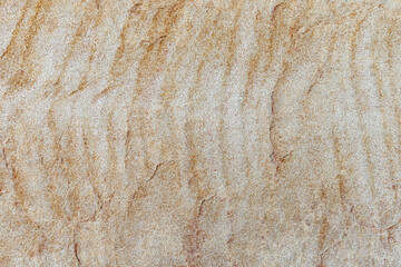 Brick texture with imitation of sand waves. Background beige brown.