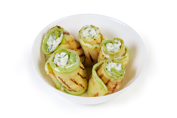 Rolls of grilled vegetable marrow with filling in bowl
