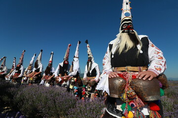 Karlovo, Bulgaria - June 27, 2020: People in traditional costumes participate in the ancient ritual "Harvesting lavender". 