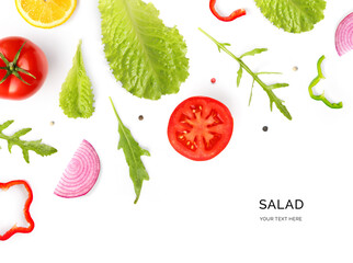 Creative layout made of summer vegetables. Food concept. Tomatoes, onion, pepper, salad leaves and lettuce on the white background.