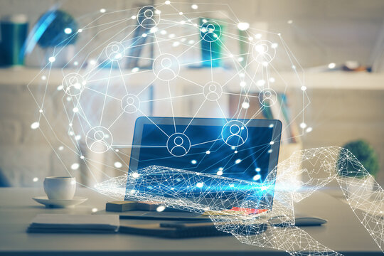 Computer on desktop with social network theme icon. Multi exposure. Concept of international connections.