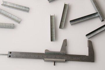 Construction brackets and ruler on a light background with copy space. The concept of construction,...
