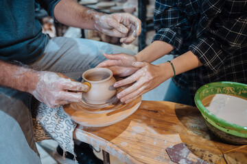 Making a handmade clay pot. Pottery lesson, hobby.