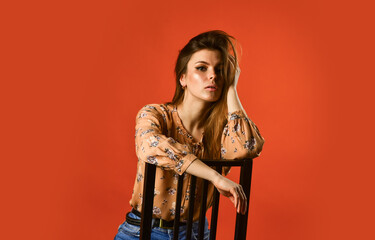 Languid look. Relaxed pose. Just relaxing. Woman beautiful face. Female fashion. Girl long hair sit on chair. Relaxation concept. Woman relaxed face alone sit on chair. Alone with her thoughts