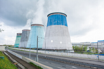 Cooling towers of a thermal power plant on a sunny summer day.