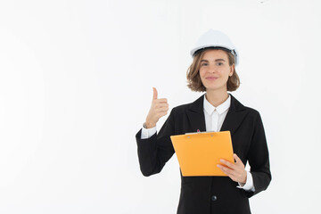 Portrait of a woman in hard hat and suit looking at camera while standing and holding clipboard with documents isolated over white background.