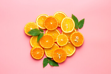 Citrus fruits sliced on pink background top view