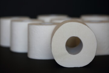 roll of toilet paper on black