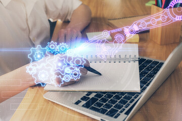 Multi exposure of woman's hands on background with technology and digital coding icons. Data development concept.