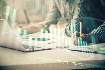 Multi exposure of forex chart with man working on computer on background. Concept of market analysis.