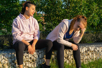 girls chatting and resting after training session. fitness, healthy lifestyle concept