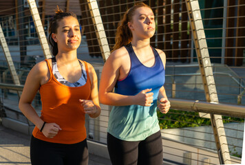 young women running training jogging routine early morning