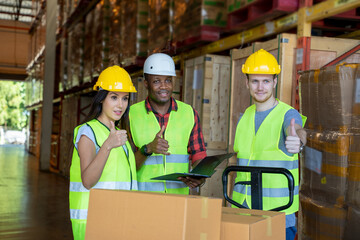 Warehouse workers team standing together in warehouse.