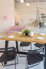 luxury modern design of a cozy small Scandinavian-style studio apartment with white walls, second floor with a library and huge high window full of day light