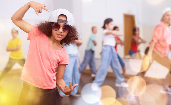 Afro girl hip hop dancer performing at class