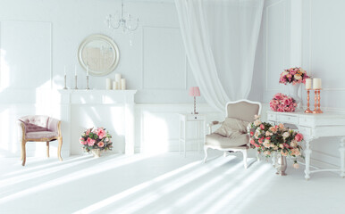 luxury clean bright white interior. a spacious room with sunlight and flowers in vases and royal chic furniture. 