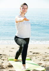 Female in white T-shirt is stretching