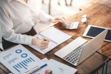 Businessman analyzing and recording information about financial business