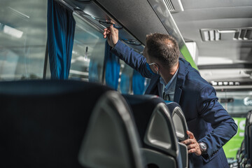 Shuttle Driver Checking Air Conditioning System In Bus.