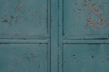 Iron wall. Cracked paint. Rust.