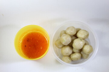 Cilok Saus Bumbu Kacang, a typical West Java food made from chewy tapioca with additional supplementary spices such as peanut sauce, soy sauce, and sauce. Cilok round shape like meatballs.