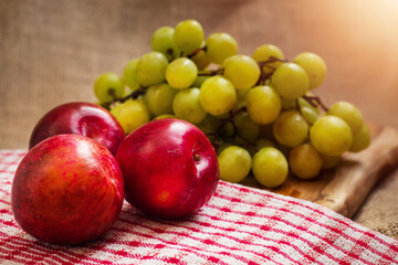 Still life. Fresh green grapes and nectarine.