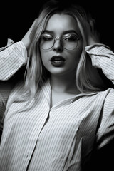 Dramatic portrait of glamorous girl wears glasses