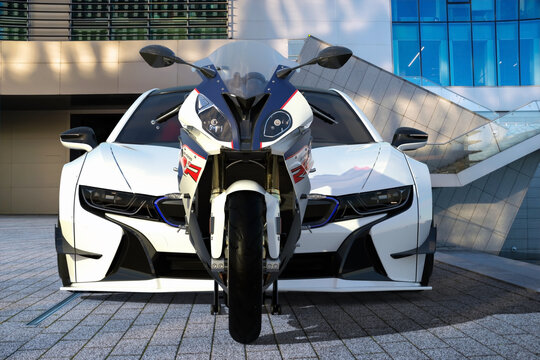 BMW S1000RR motorcycle versus BMW I8 electric sports coupe
