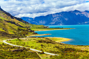 Green grassy mountains surround the Javea Lake