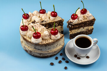 Tiramisu cake, cup of coffee, roasted coffee beans.
