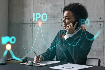 Businesswoman speaks phone and ipo icon hologram. Double exposure. Initial primary offering invest concept.
