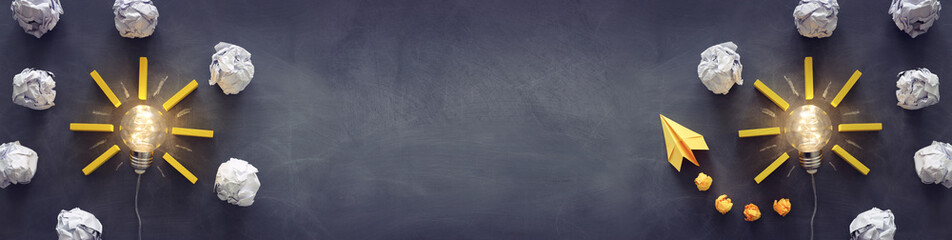 Education concept image. Creative idea and innovation. Light bulb as metaphor over blackboard