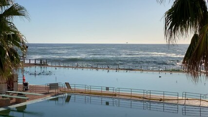 Sea Point pavilion two salt water swimming pools with diving boards at the ocean edge
