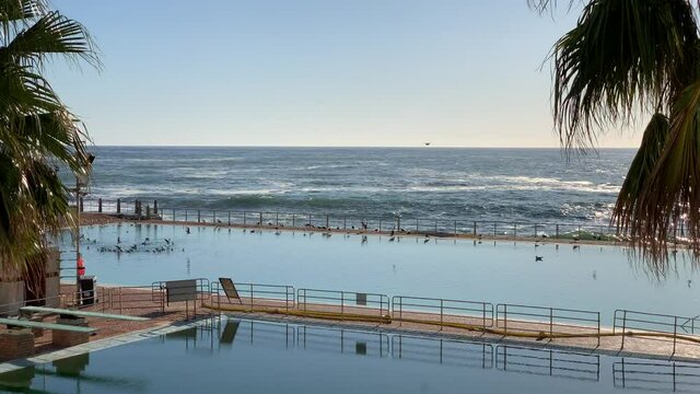 Sea Point pavilion two salt water swimming pools with diving boards at the ocean edge