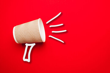 Takeaway coffee in shout concept on red background. Promotion or advertising sale.
