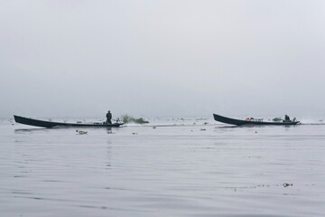 Traditional fisherman on a boat on Inle Lake Myanmar Burma