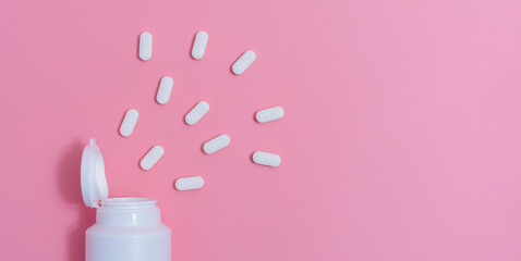 Vitamin pills spilling out.