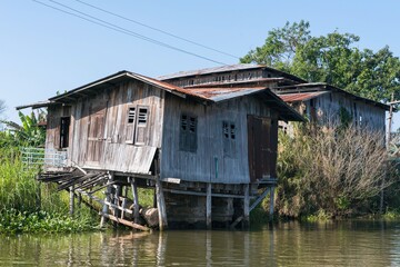 Fototapeta na wymiar Houses on Inle lake in Nyaungshwe Township of Shan State. Shan Hills in Myanmar Burma