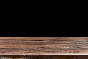 Oaken table from wooden planks on a black background for display or present your products.