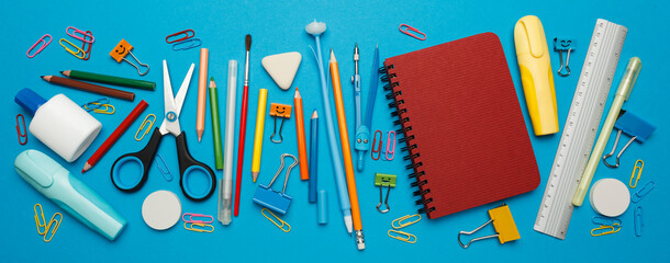 Back to school stationery set on blue background.