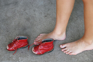 old red children pair of leisure boots and woman foot