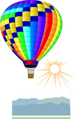Fototapeta premium colorful balloon flying over the mountains in front of the sun