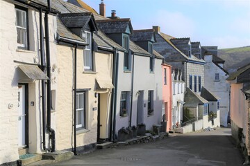 A colourful narrow street leading down to the harbour at Port Isaac, Cornwall, England.