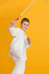 Little boy as a karate fighter. Funny faces.