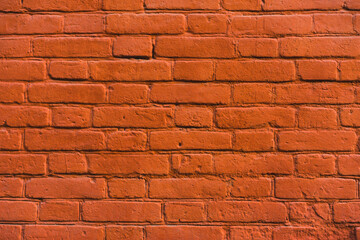 Fototapeta premium brick red wall. background of a old brick house.