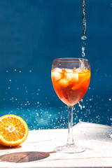 Summer alcoholic refreshing cocktail - Aperol spritz. Popular italian drink